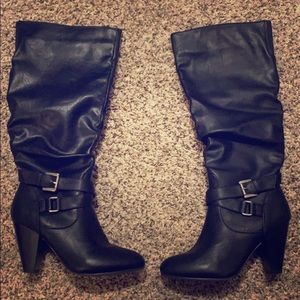 Black zip high heeled boots